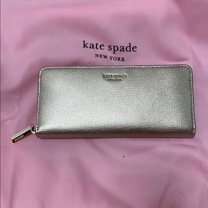 Kate Spade pale gold slim continental wallet.